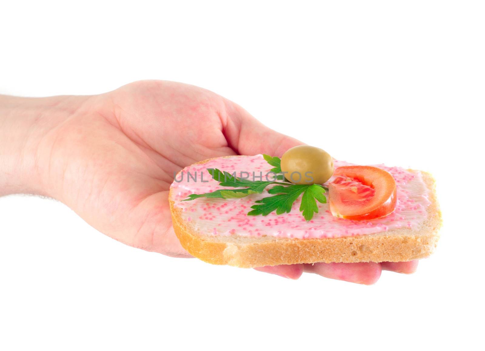 hand holding toast with fish caviar cream