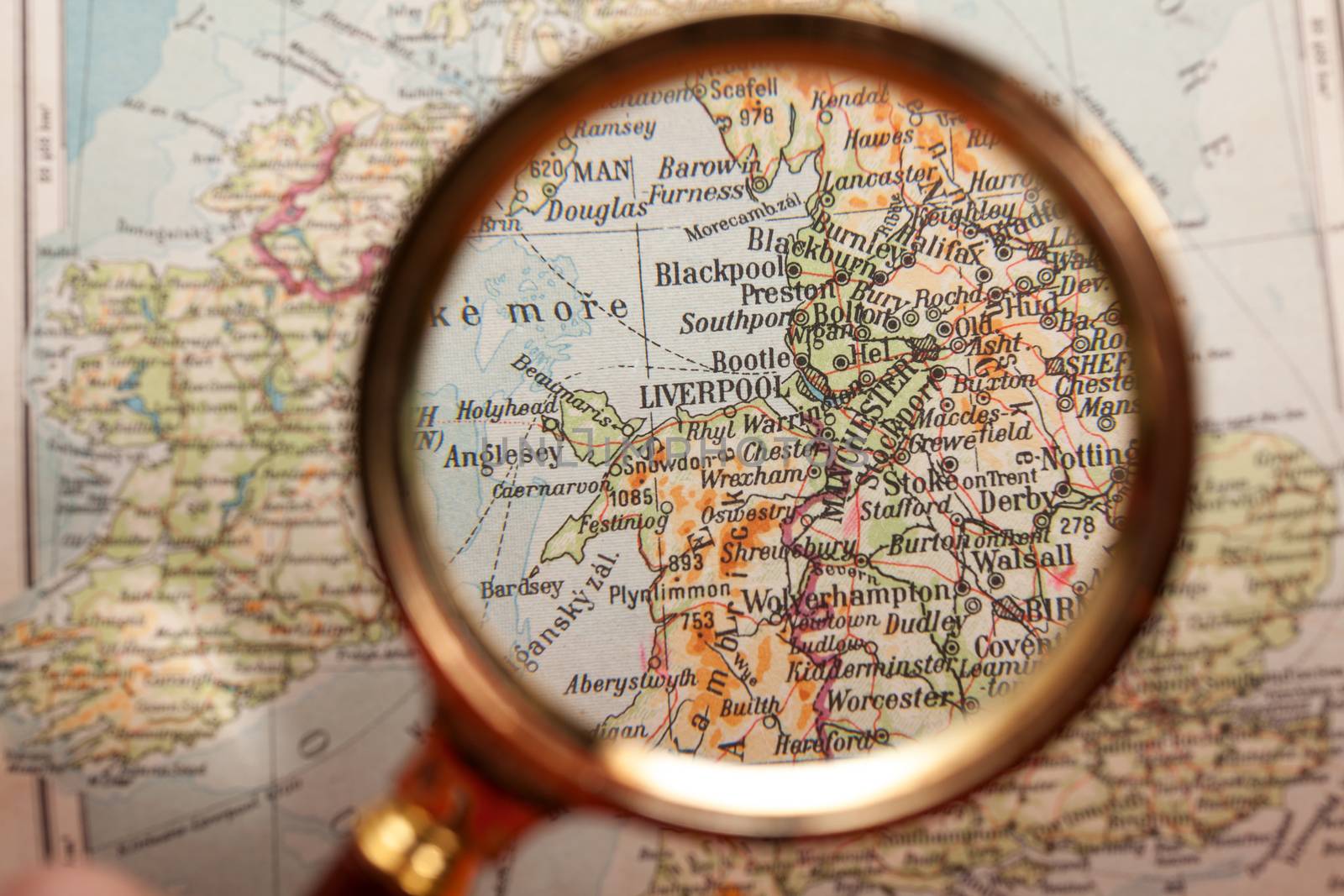 Magnifying glass and map by Portokalis