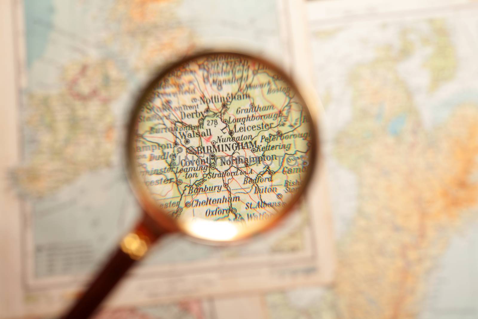 Magnifying glass and map by Portokalis