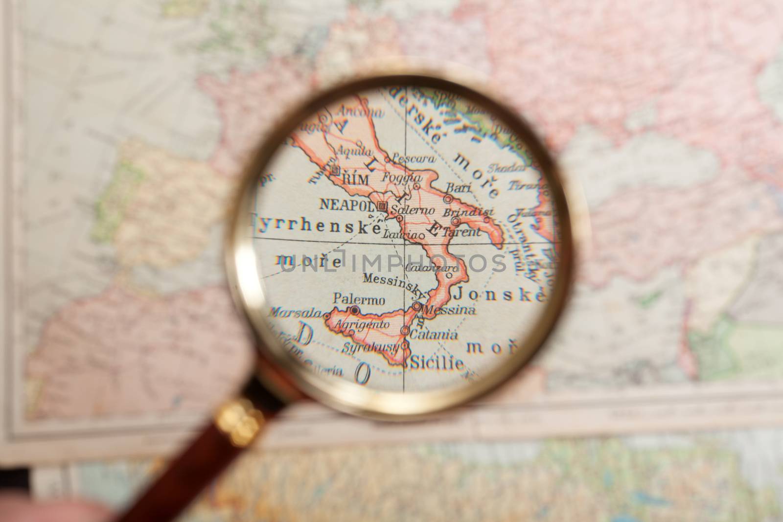 Magnifying glass and map by Portokalis