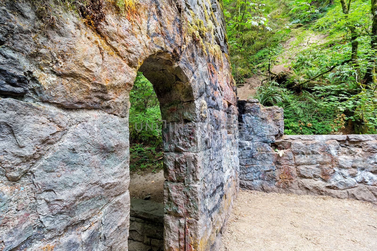 Abandoned stone castle house archway at Wildwood Trail in Forest Park Portland Oregon