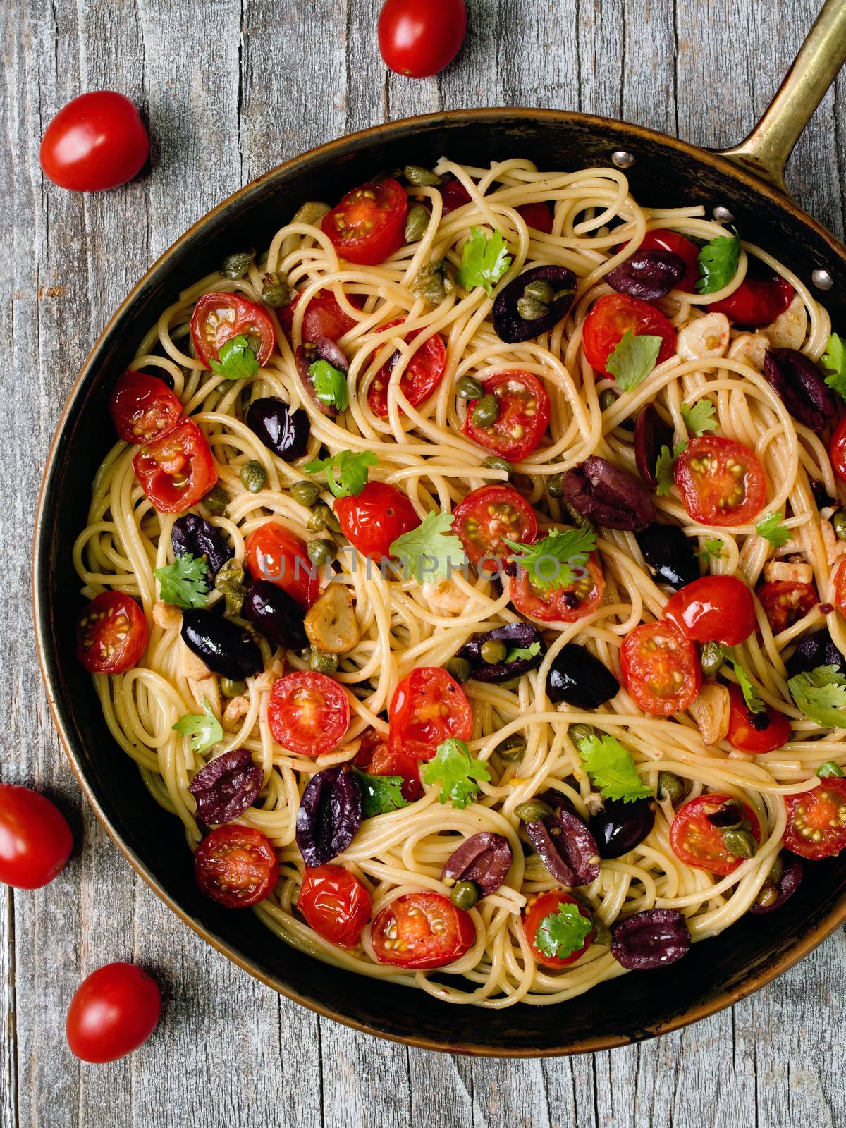 close up of rustic italian spaghetti puttanesca pasta