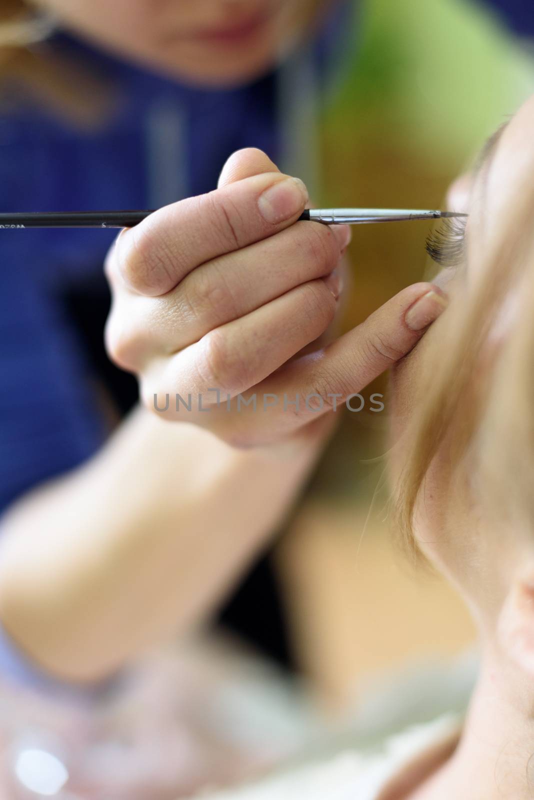 the makeup artist paint the eyes