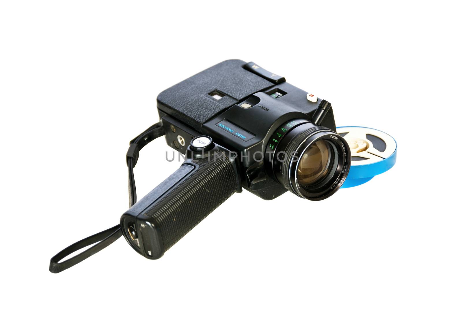 Super 8 movie camera and developed film. Isolated on a white background.