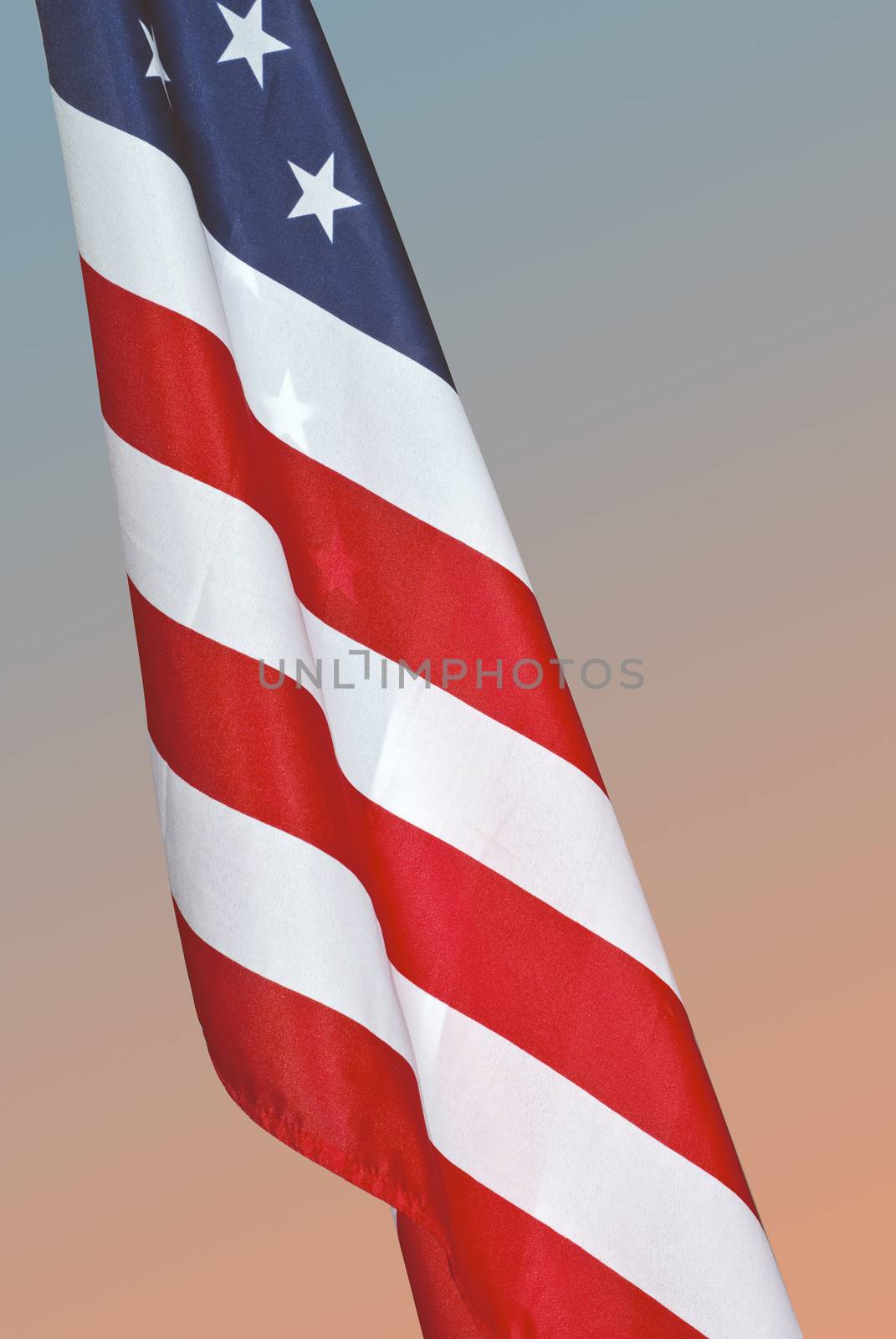 American flag isolated with a clipping path against a morning gradient.
