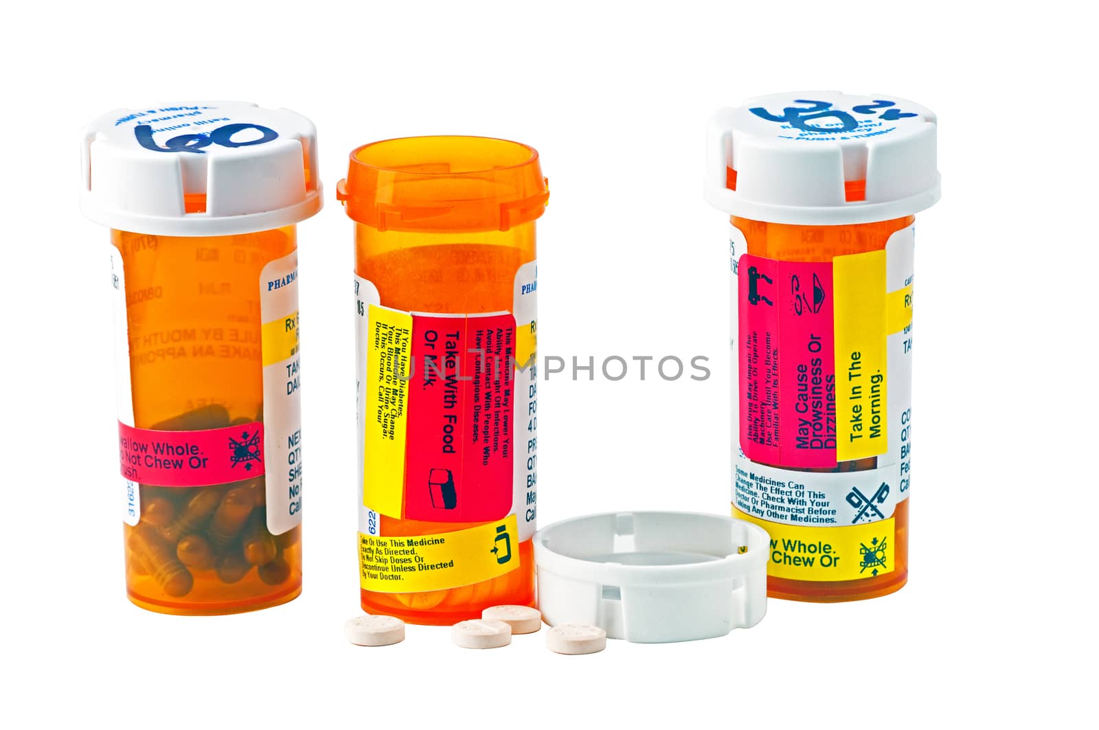 Three bottles of medicine with child proof caps