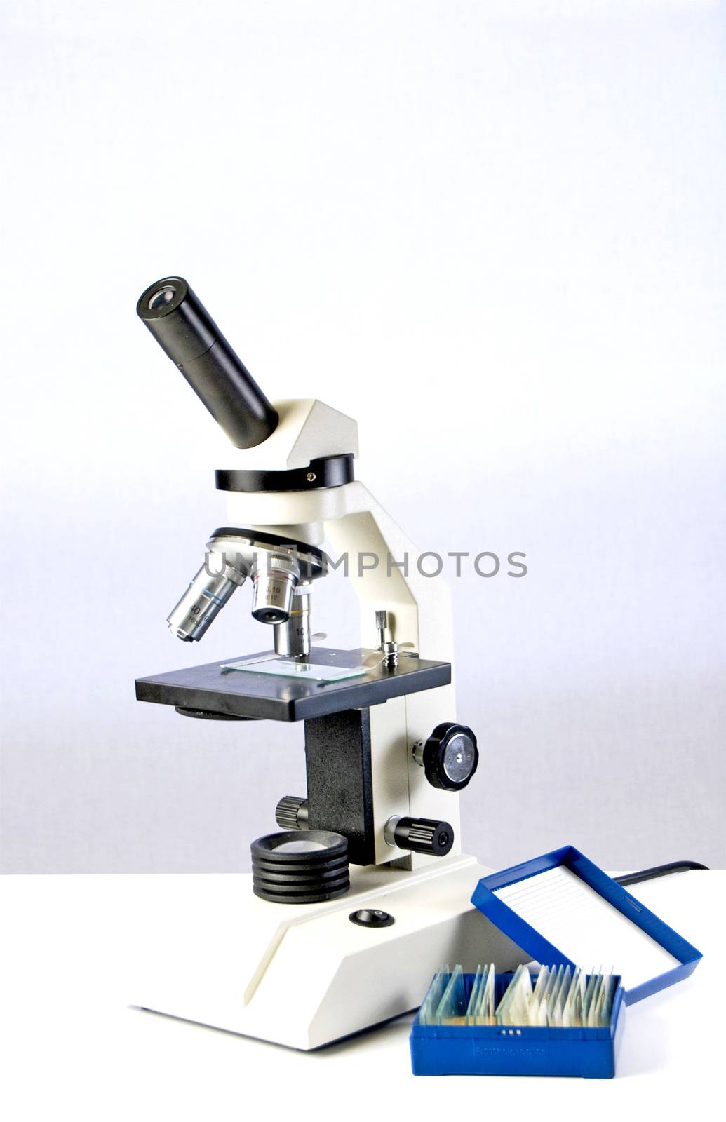 Microscope and slides used by a student for his Biology class.