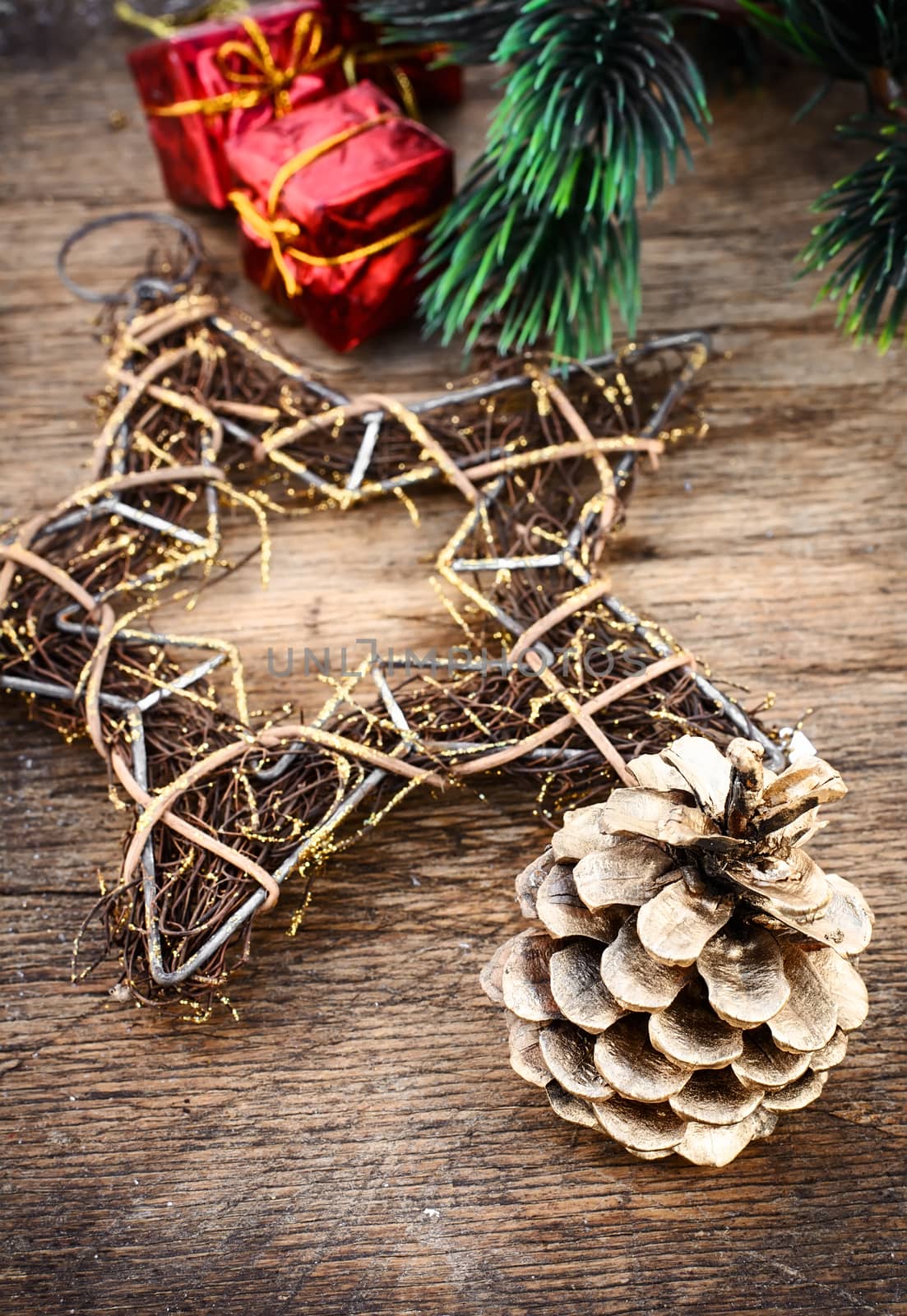 Christmas decorations and gifts on a background of pine branches