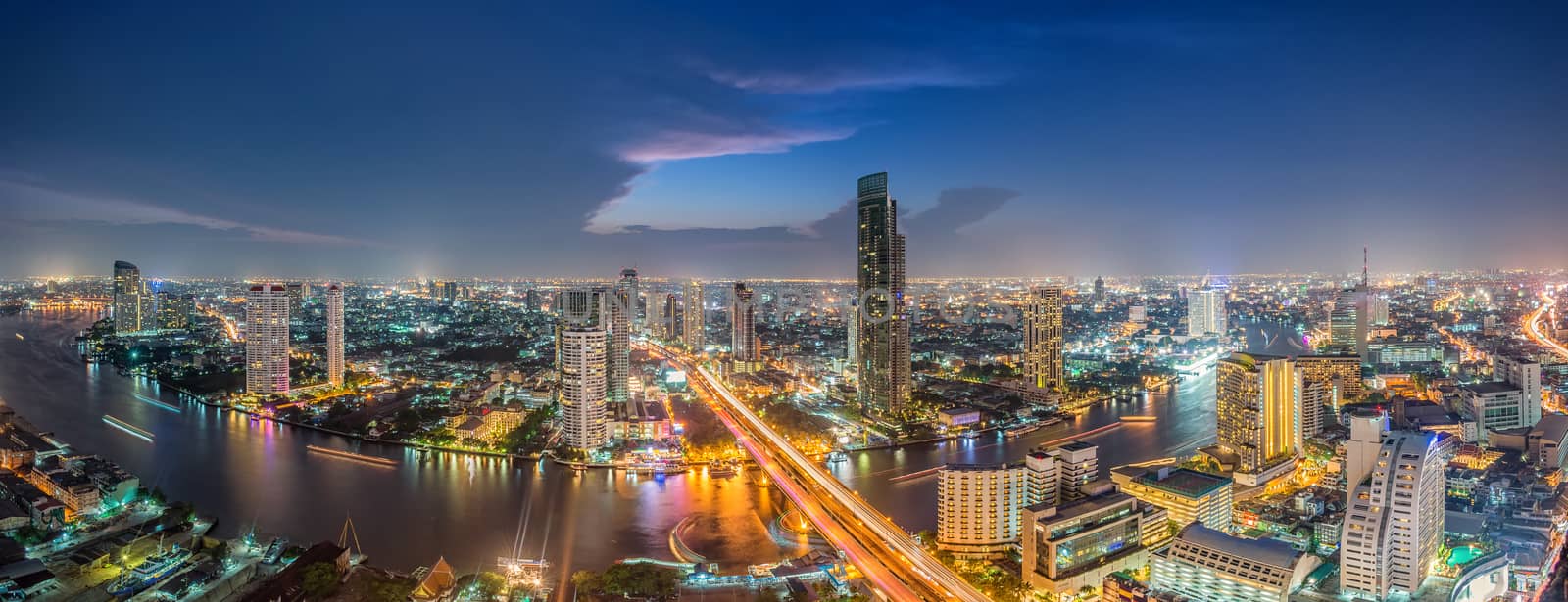 Bangkok Transportation at Dusk with Modern Business Building along the river (Thailand)-Panorama