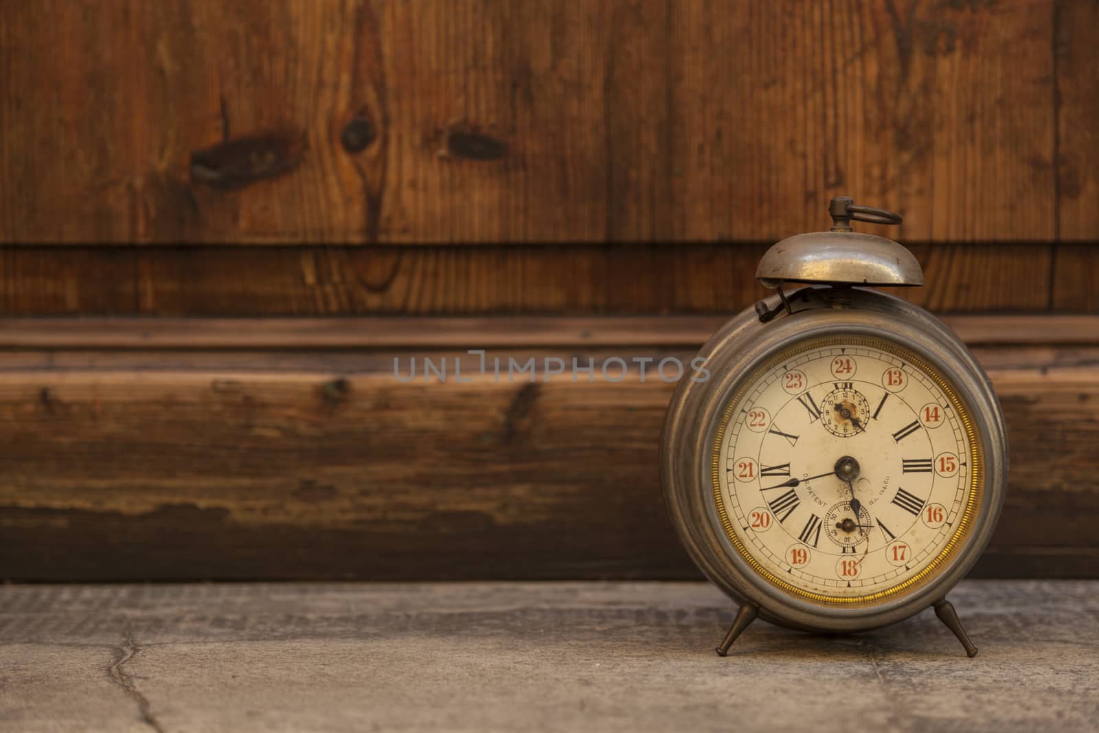 Vintage and old clock on wood background