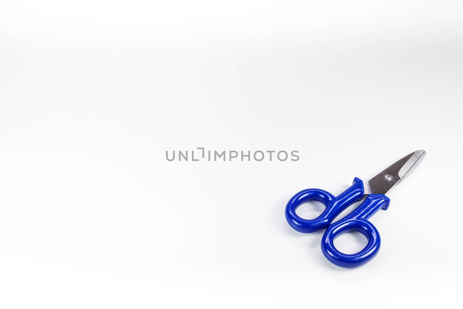 Typical electrical used scissors with blue arms