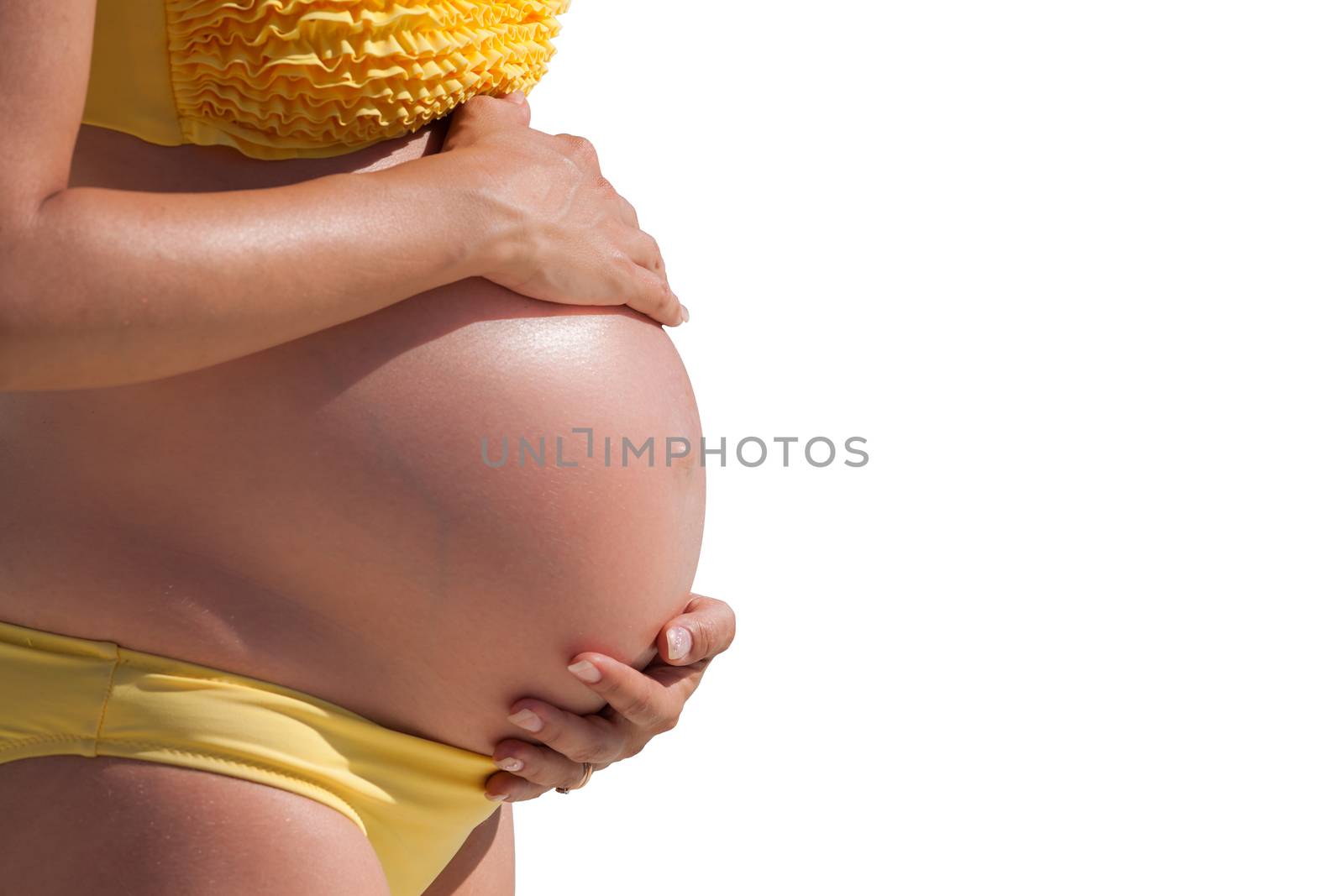 Pregnant woman with hands over tummy at white background