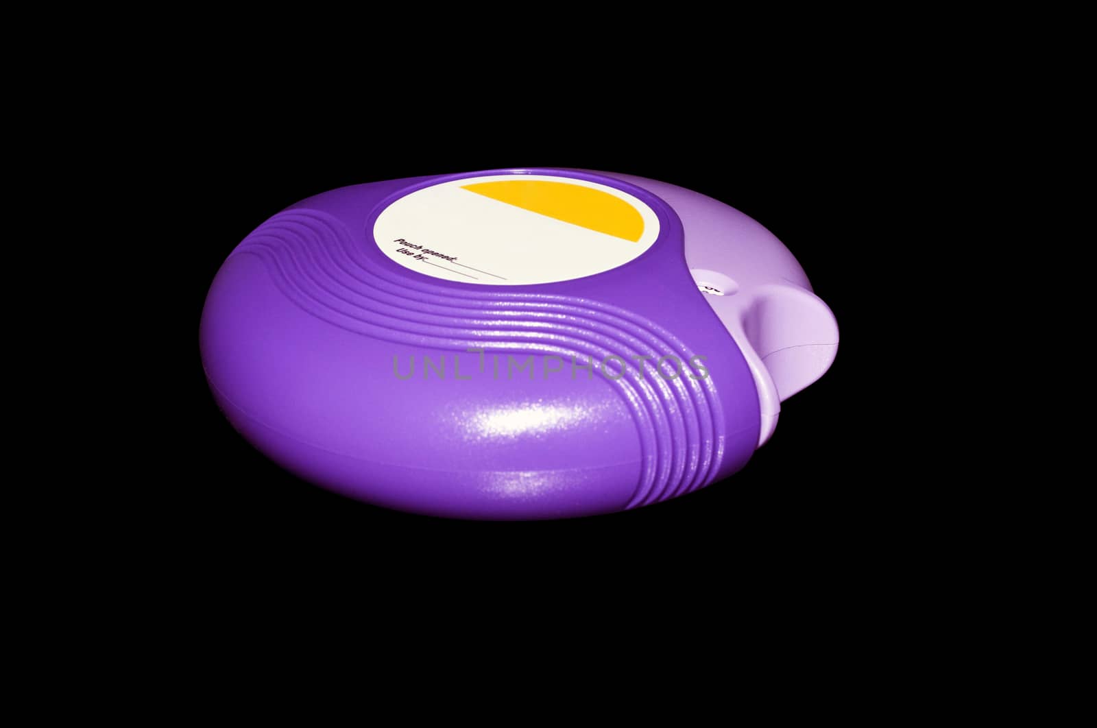 Plastic inhaler for daily treatment of COPD and Emphysema. Isolated on a black background with a clipping path.
