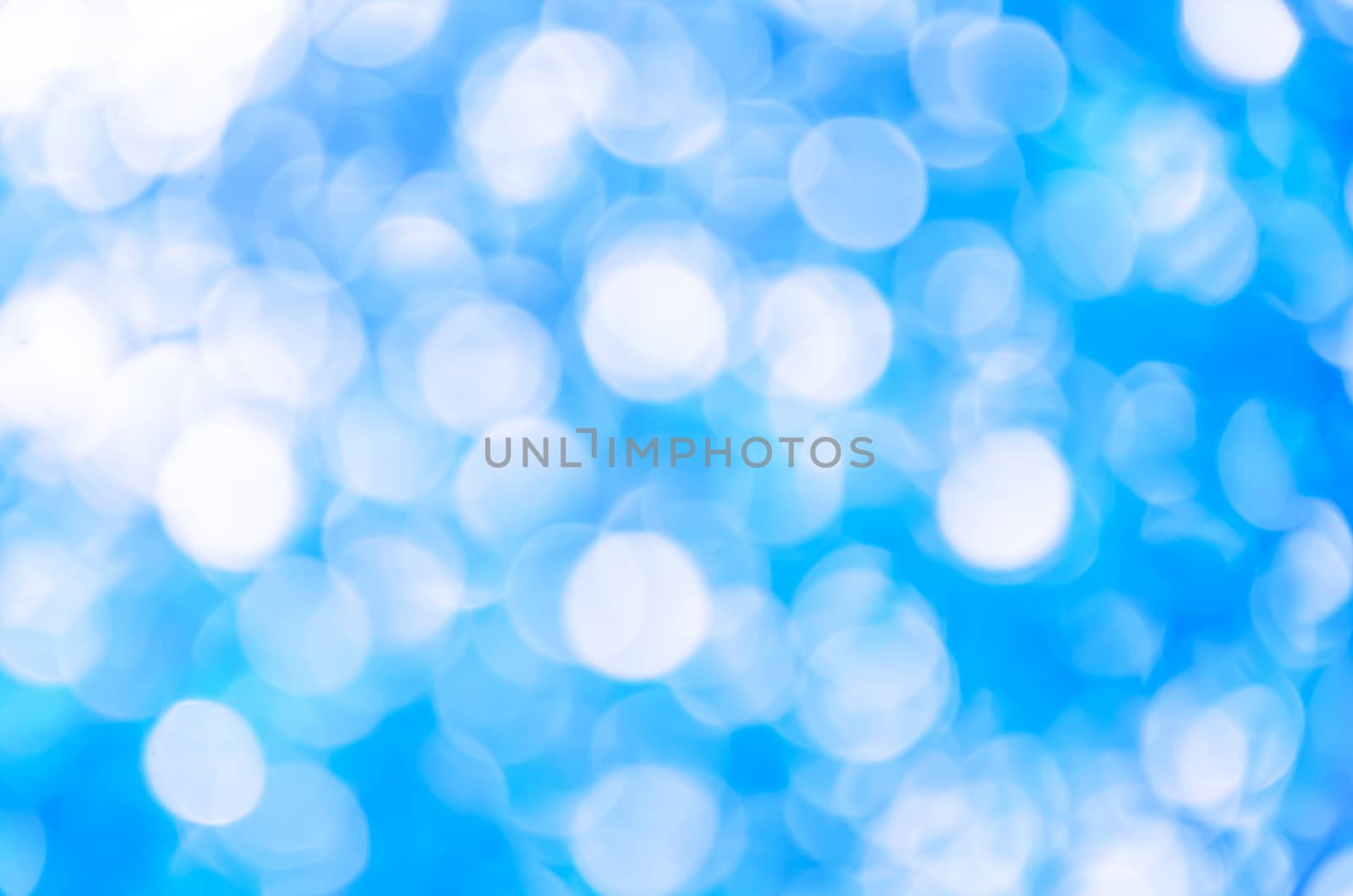 Blue light bokeh background by worrayuth