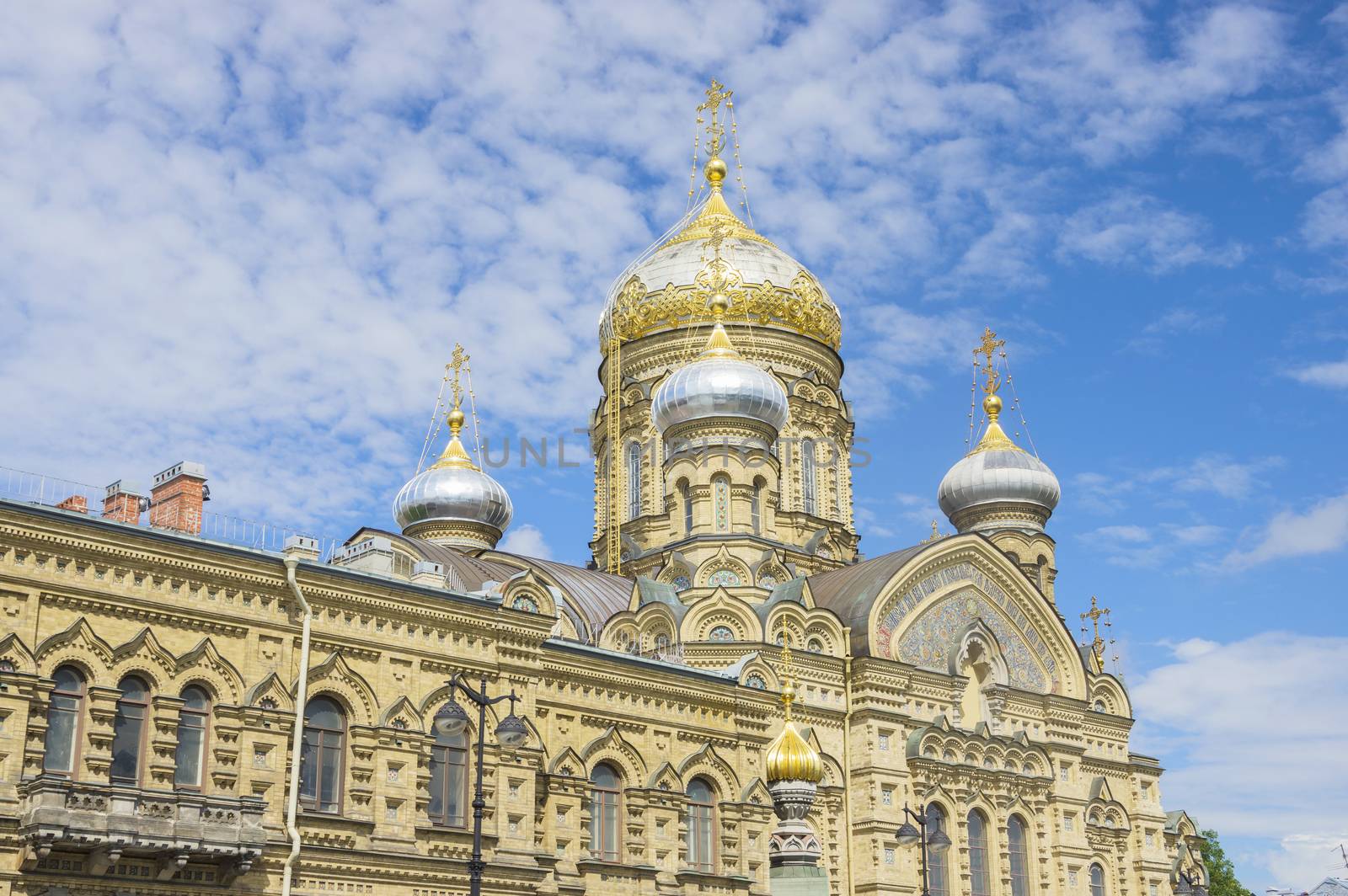 beautiful Christian church in St. Petersburg with golden domes and crosses