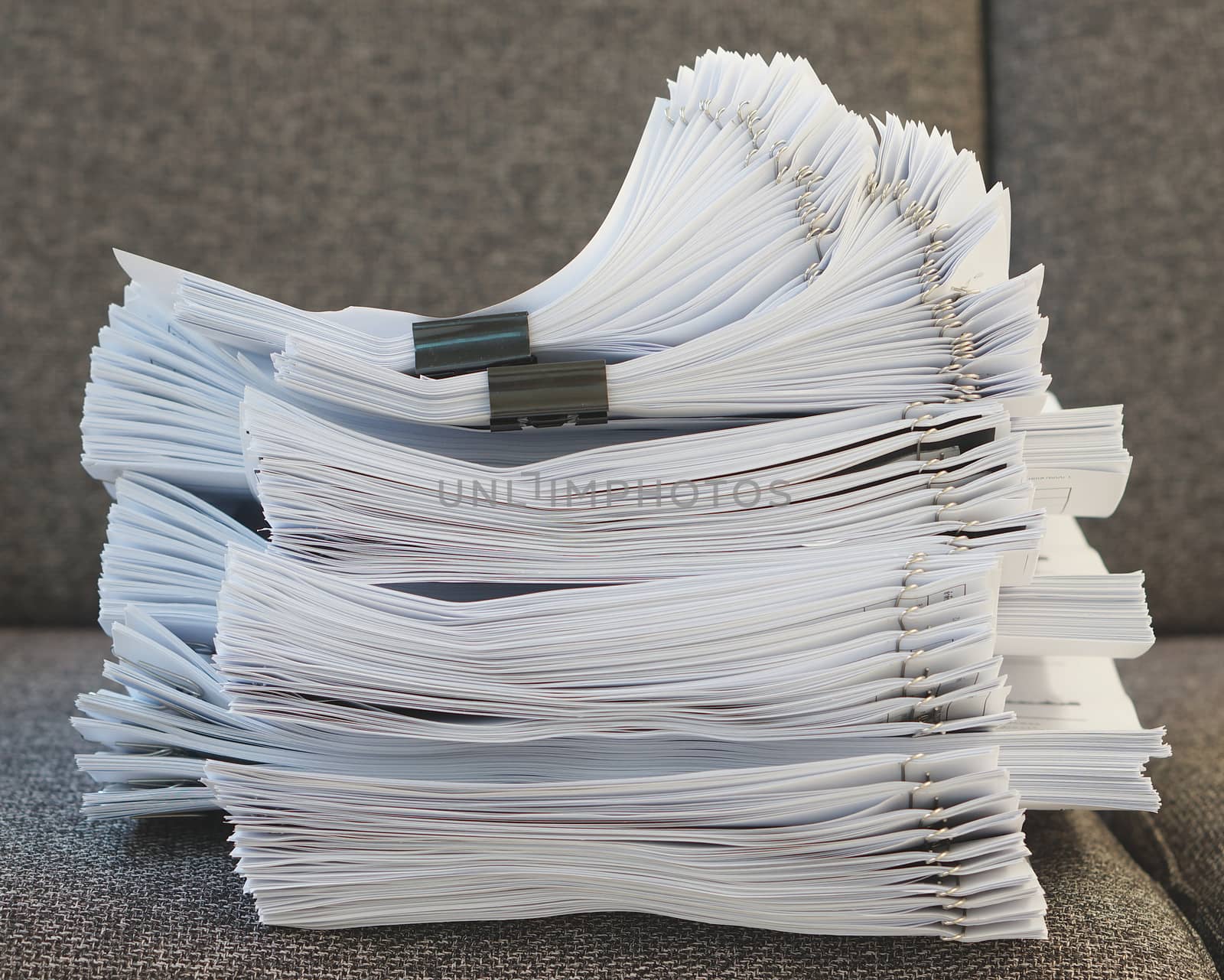 Stack of document on sofa at office by ninun