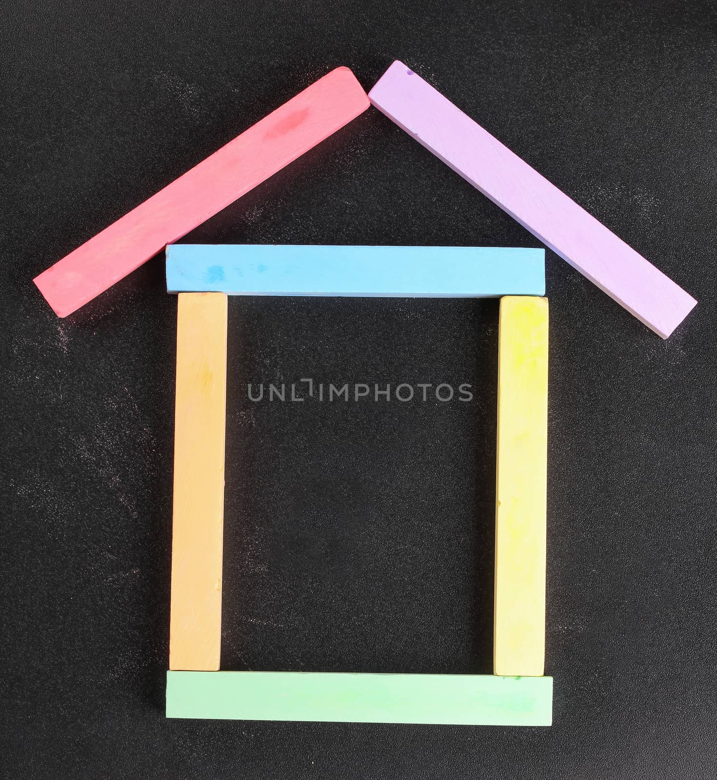 set of colored crayons on a black background