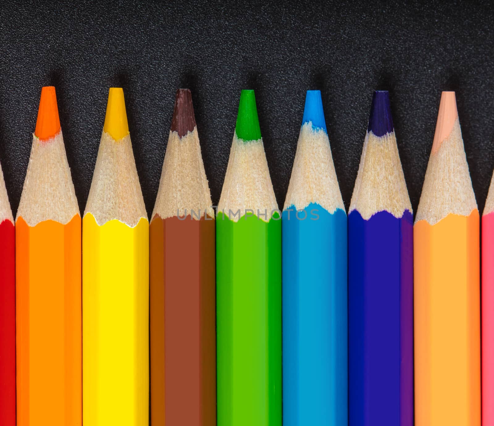 colored pencils close-up while lying in a row