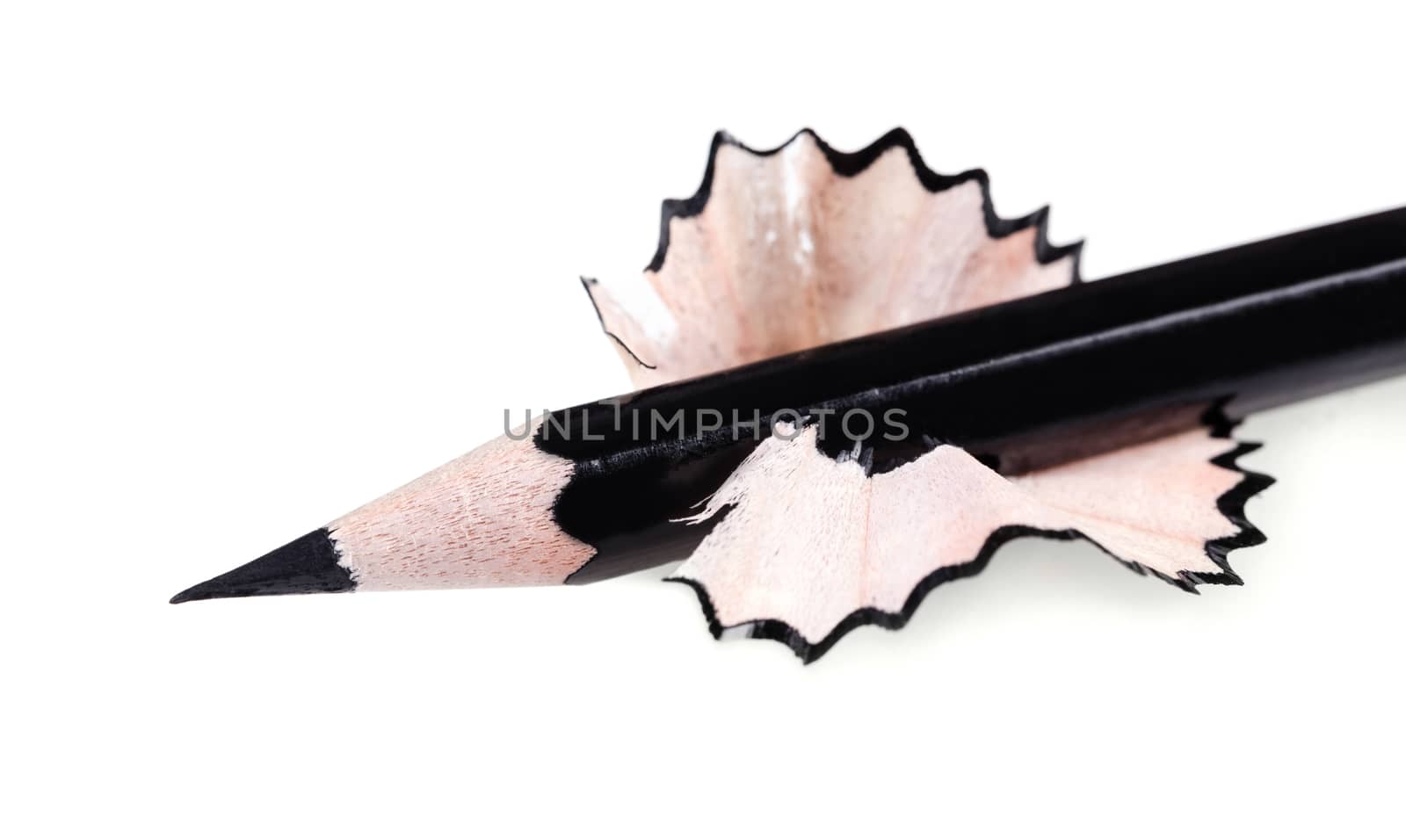 black sharpened pencil close-up on a white background