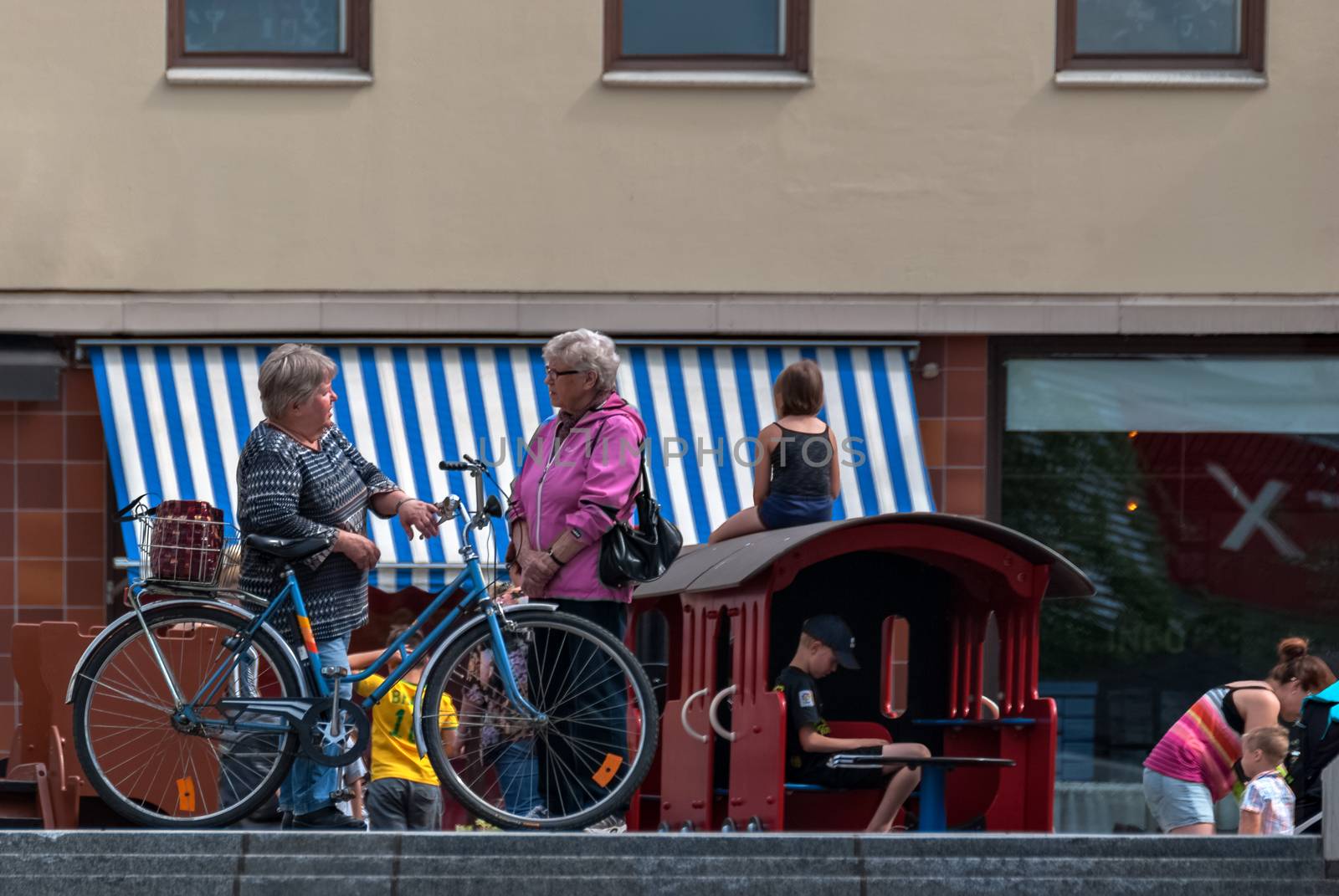 IMATRA, FINLAND, June 24: A leisurely conversation between two elderly women on the main street of the Finnish town of Imatra, 24 June 2016.