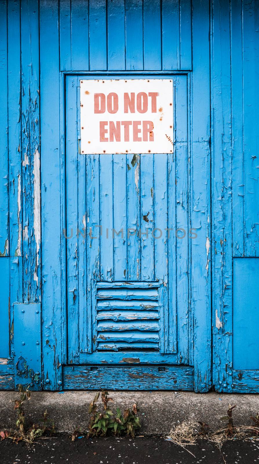 Grungy Rustic Blue Door iIth Do Not Enter Sign