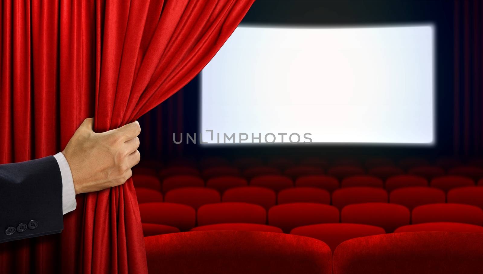 Hand opening curtain before movie show