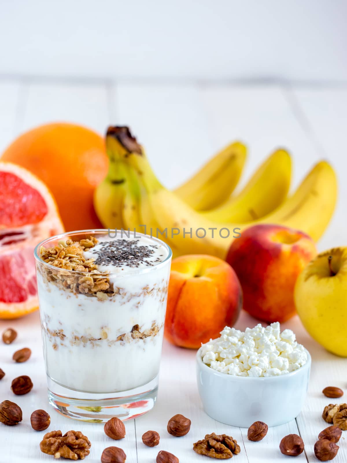 cottage cheese, yogurt, fruits and nuts vertical by fascinadora