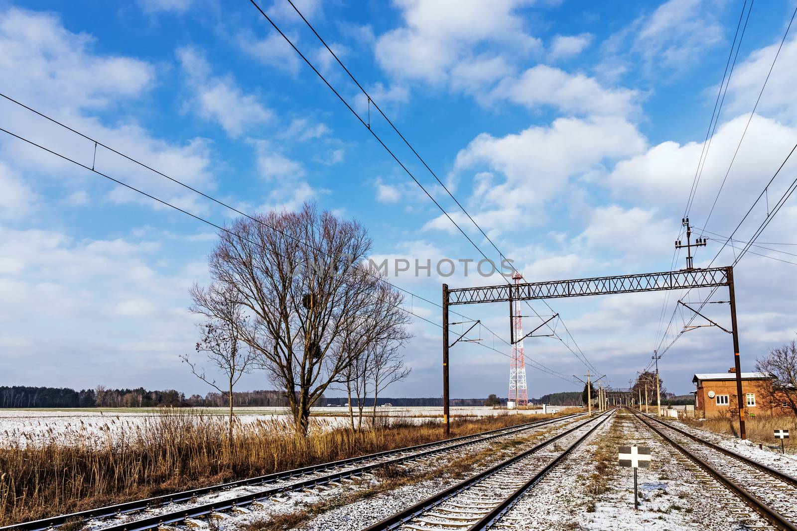Rural landscape with railroad tracks.