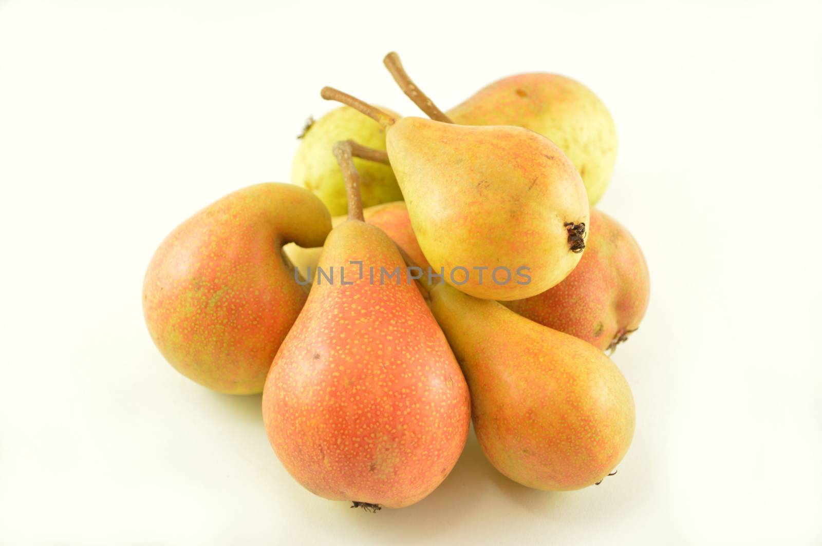 Pears in a bowl isolated on a white background.