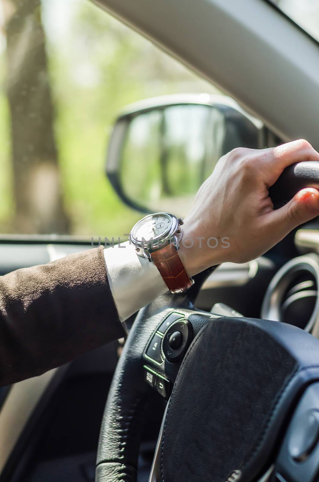 Bridal car. watch the groom, the groom behind the wheel