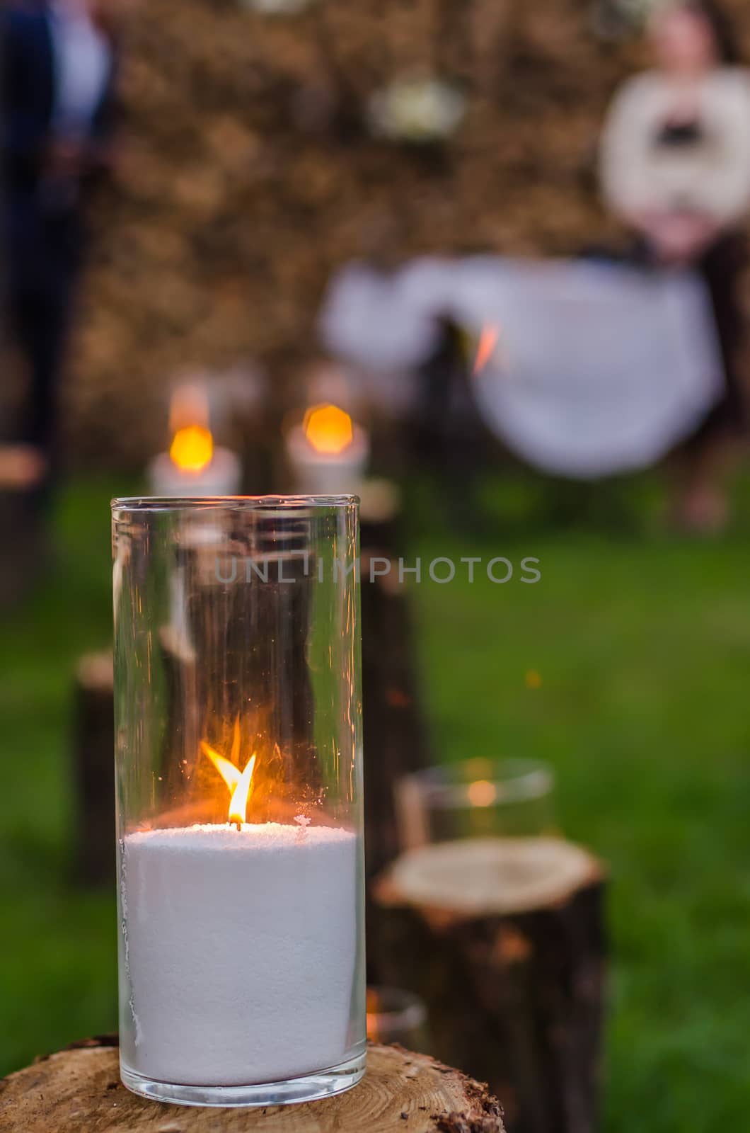 wedding decor, candles on the cut stumps