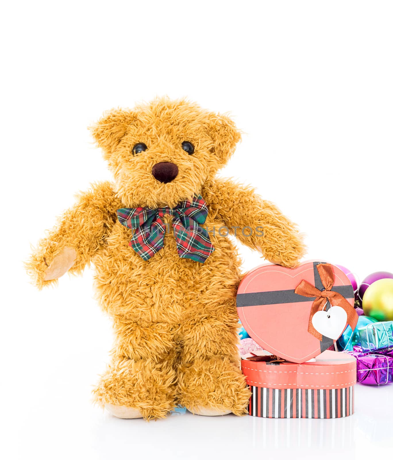 Teddy bear with 
Red heart shaped gift box on white background