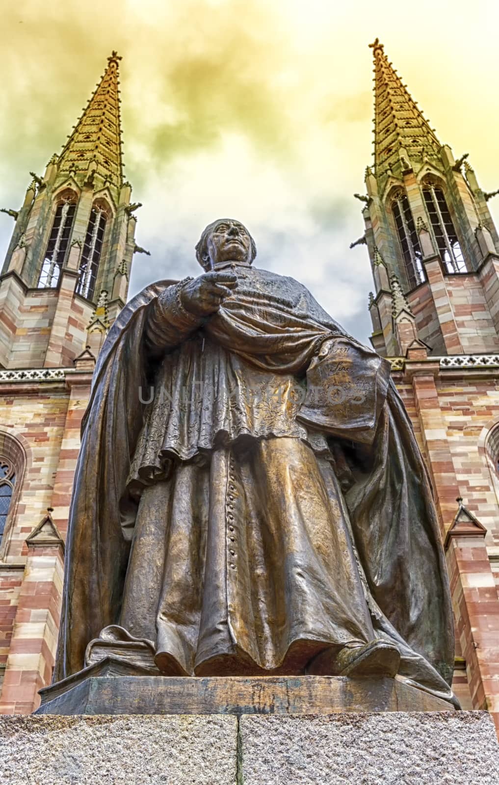 Charles-Emile Freppel statue in front of Saints-Pierre-et-Paul-Church in Obernai, France by Elenaphotos21