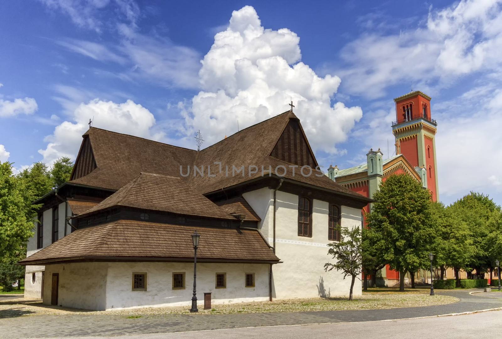 Wooden articular church in Kezmarok and lutheran tower by day, Slovakia