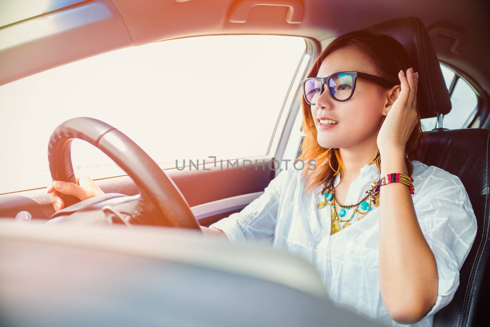 asian woman driving a car by PhairinThee