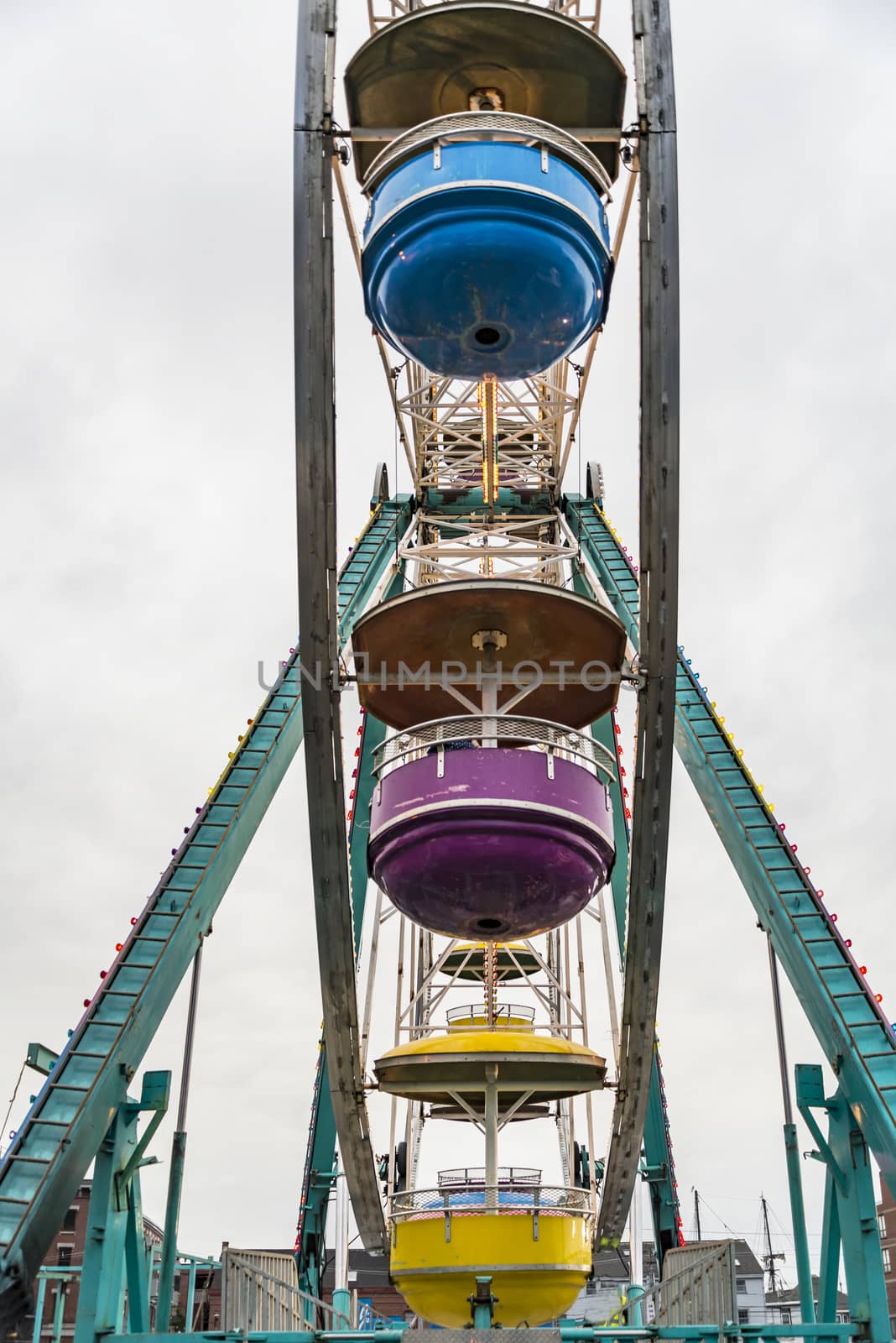 Ferris wheel on cloudy sky background vintage color