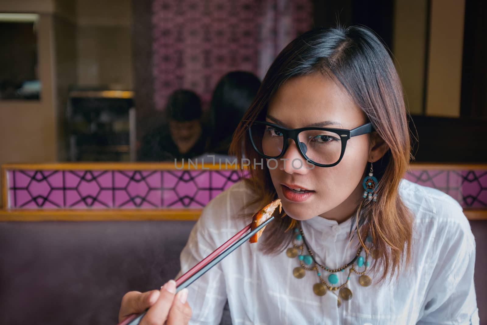 Asian women eating lunch with hunger.