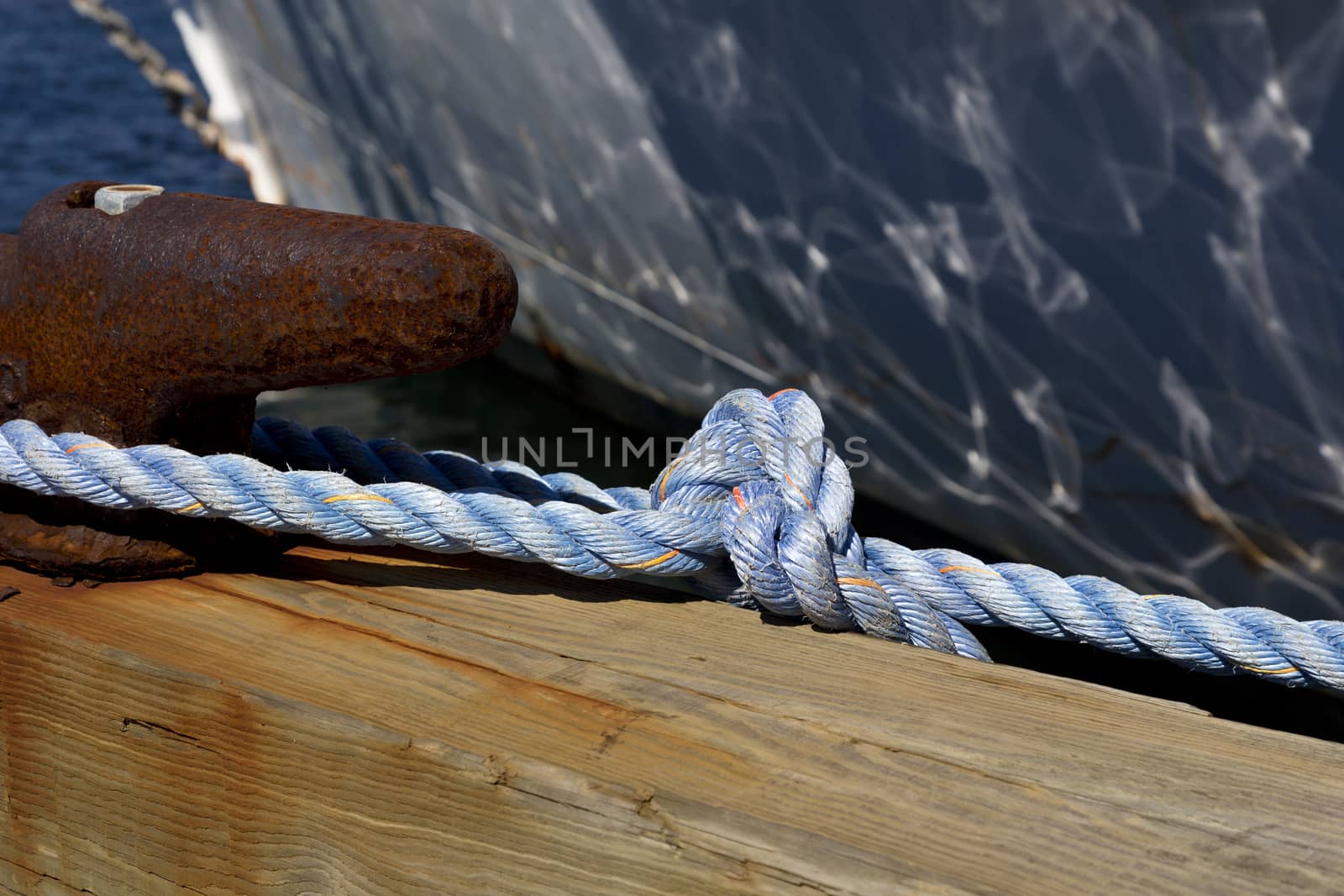 Focus on nautical rope tied to cleat in Newport Marina, Rhode Island, USA.  