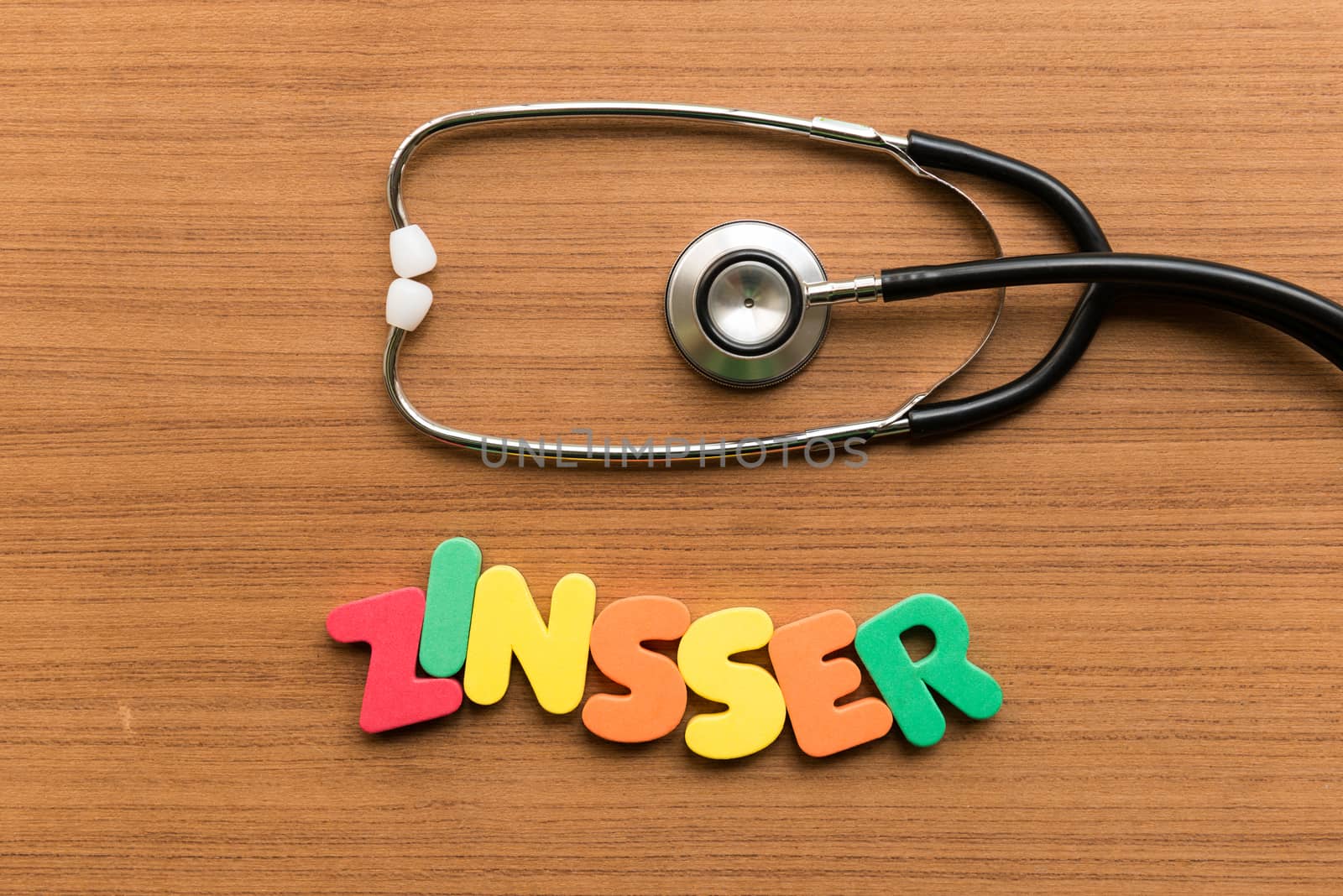 zinsser colorful word with stethoscope on wooden background