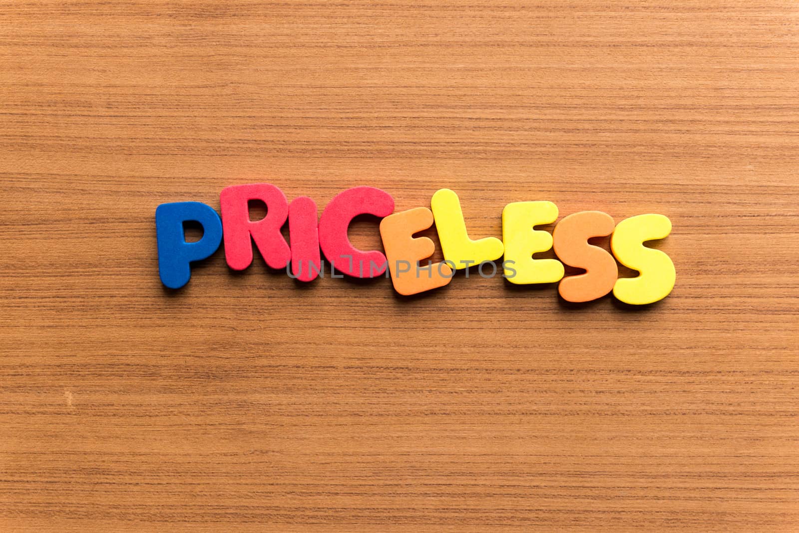 priceless colorful word on the wooden background