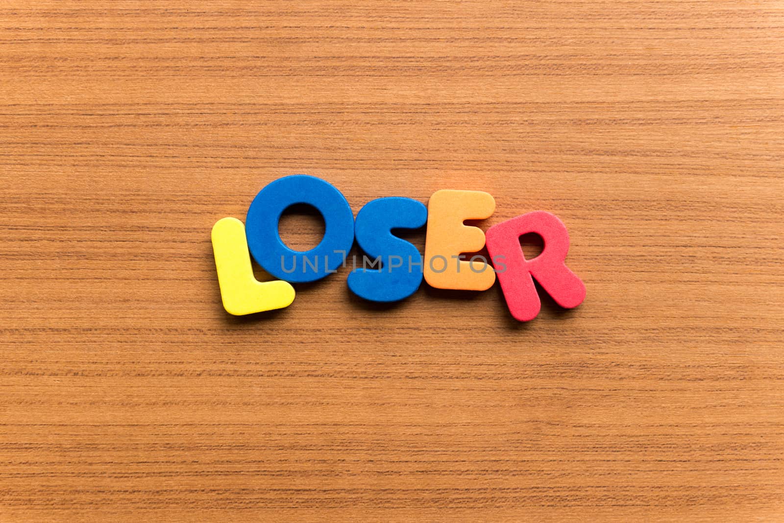 loser colorful word on the wooden background
