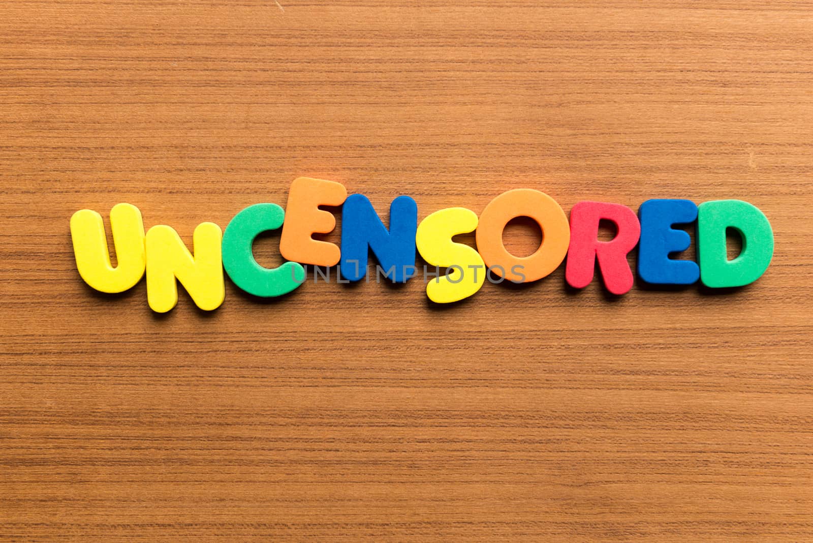 uncensored colorful word on the wooden background
