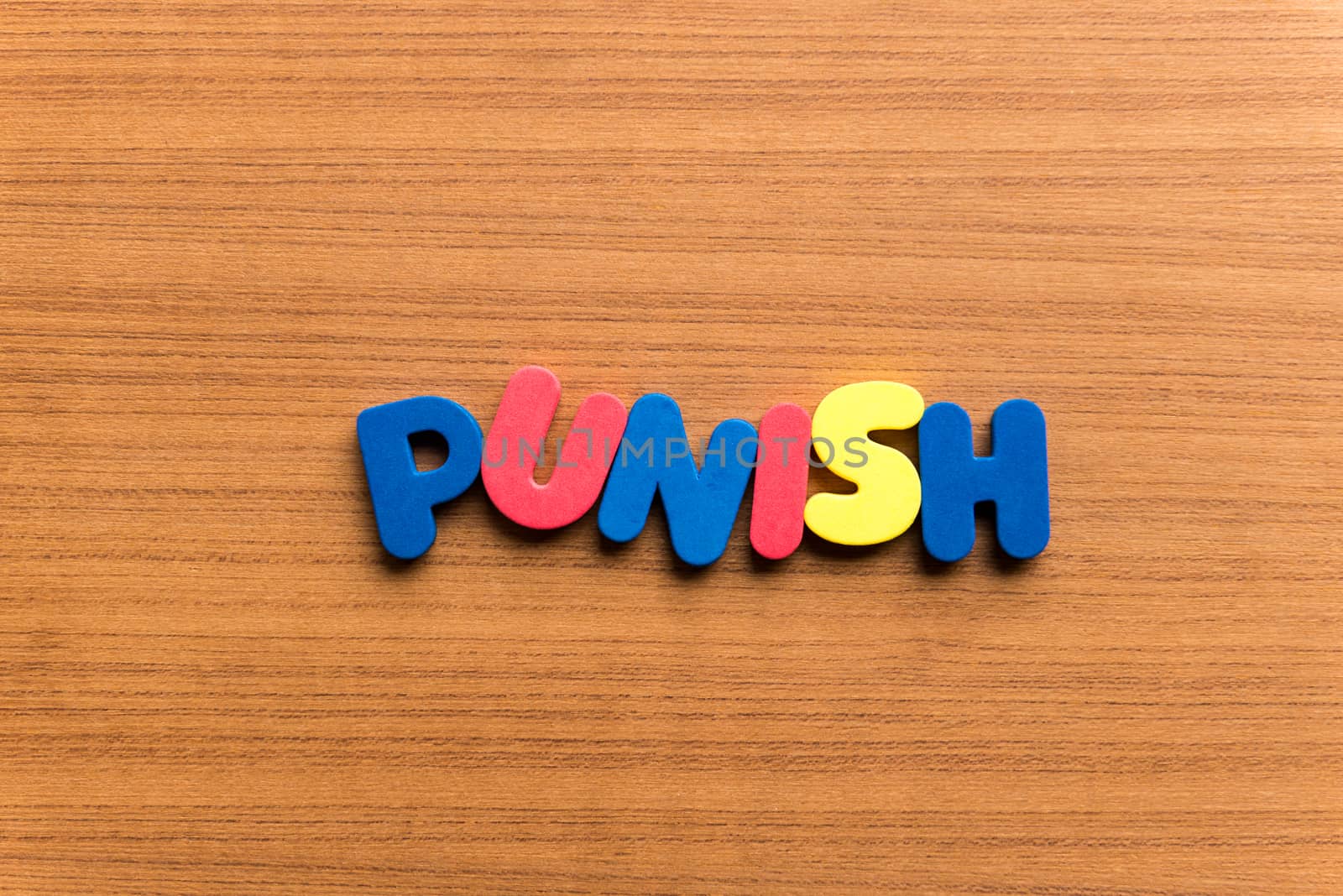 punish colorful word on the wooden background