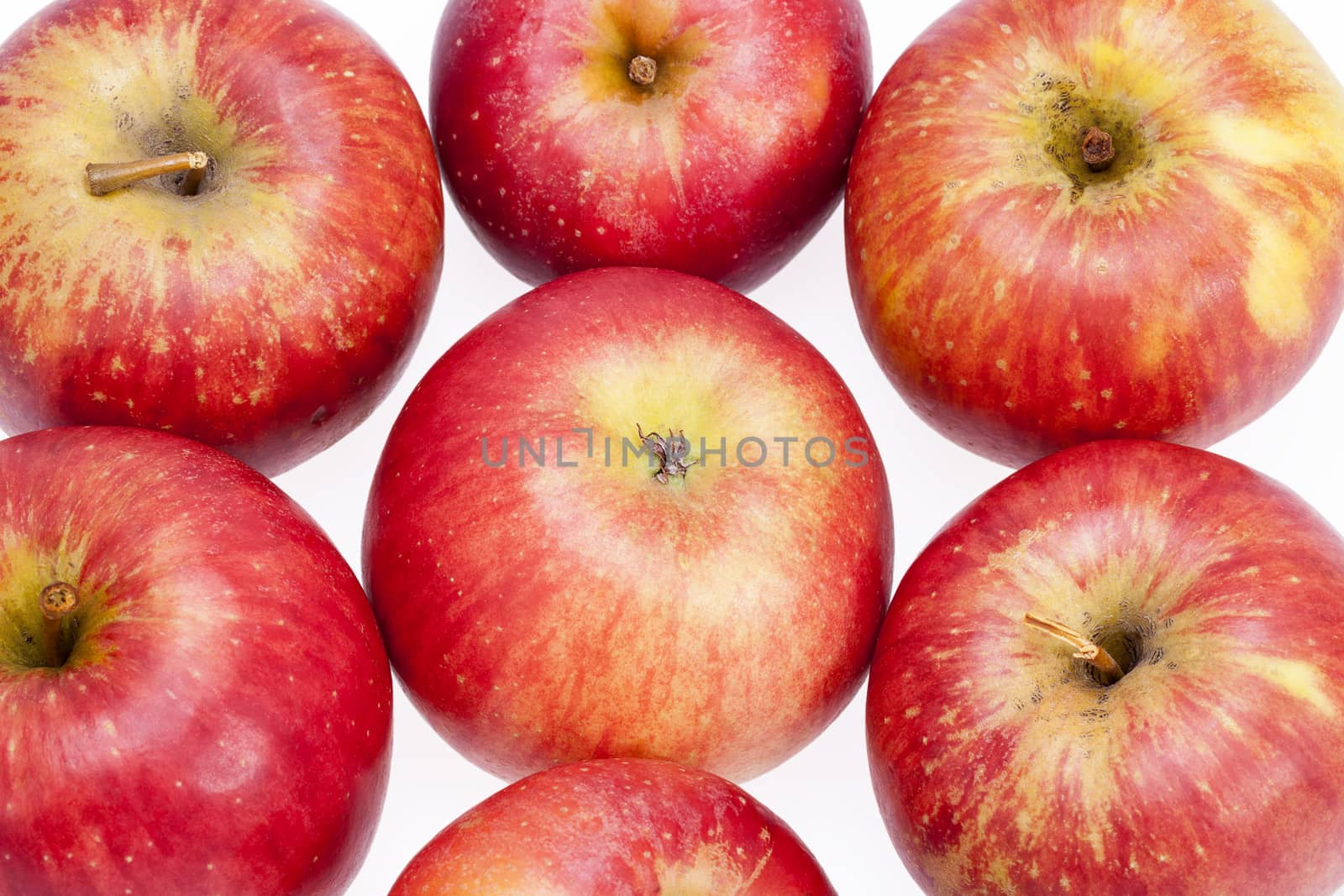  Group of red apples isolated on white background, close up .