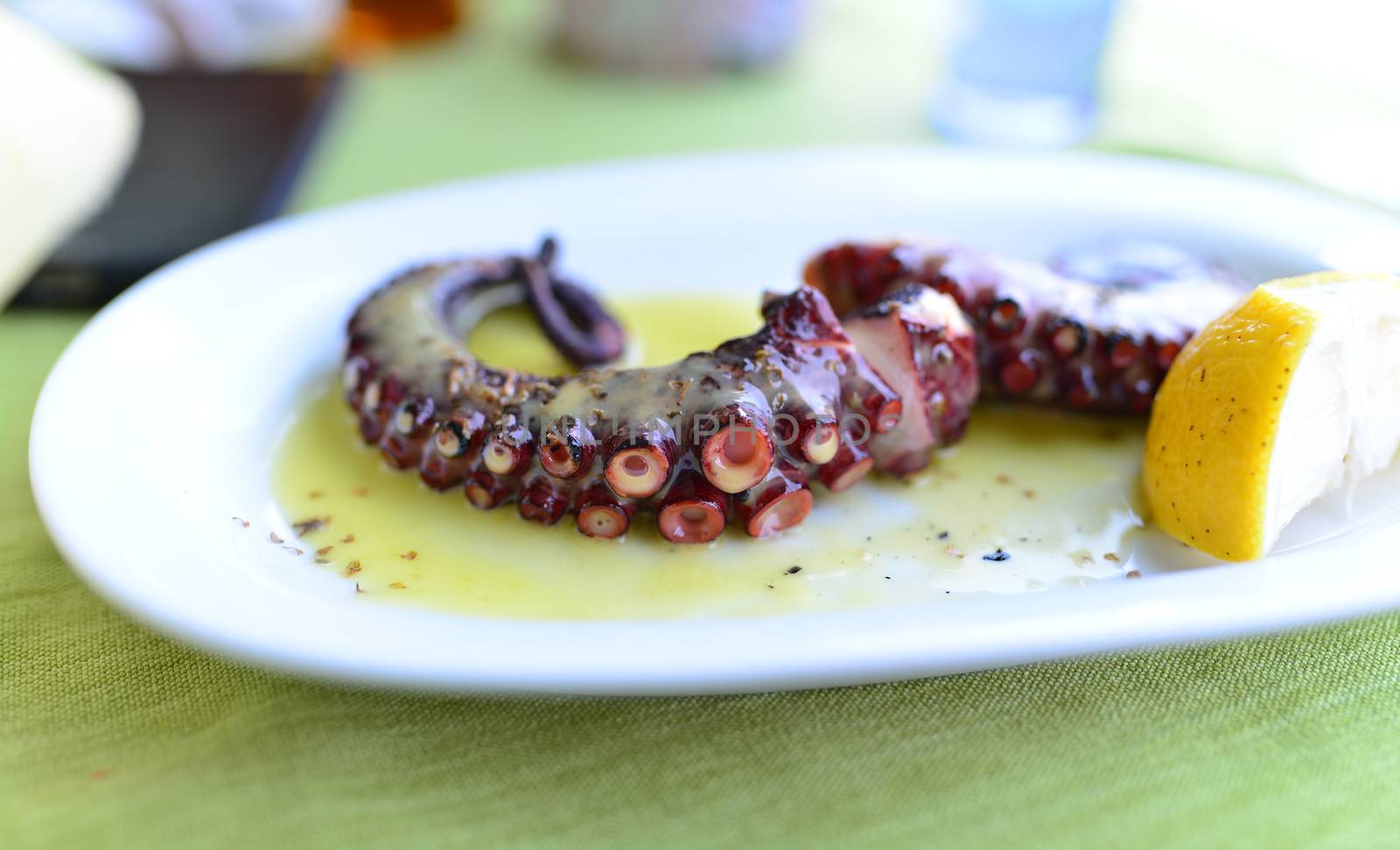 sea food restaurant octopus tentacle plate detail