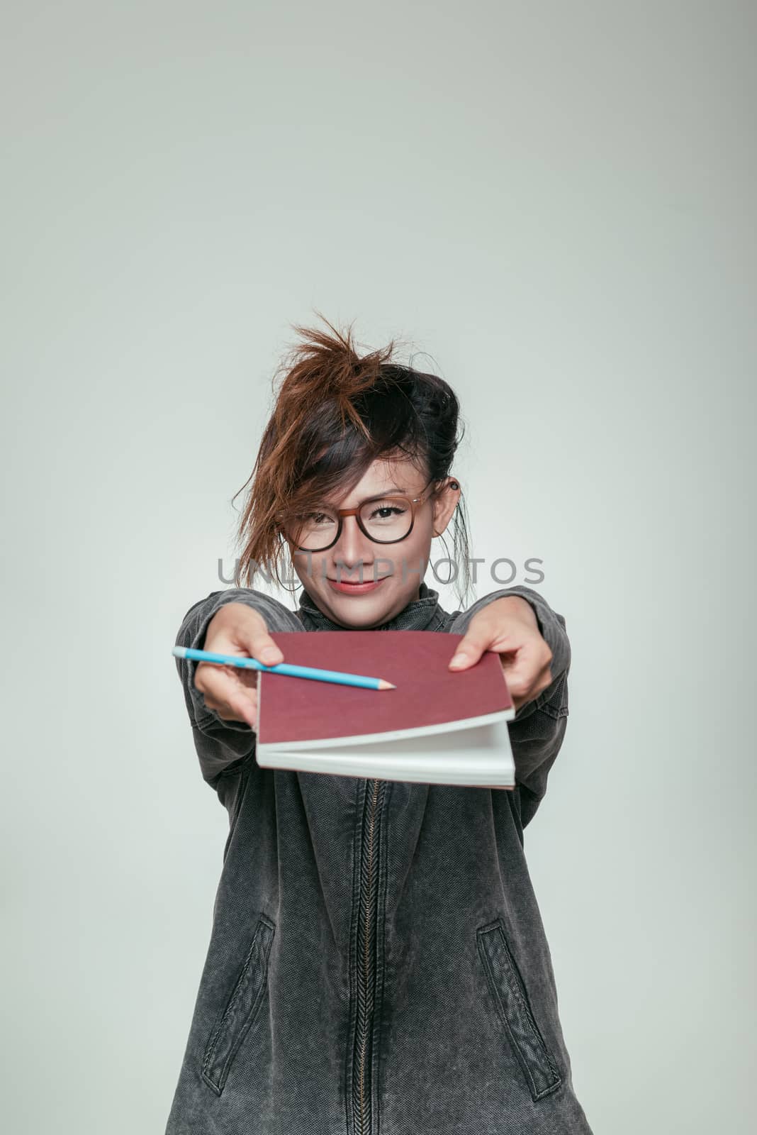 Asian women holding a book by PhairinThee