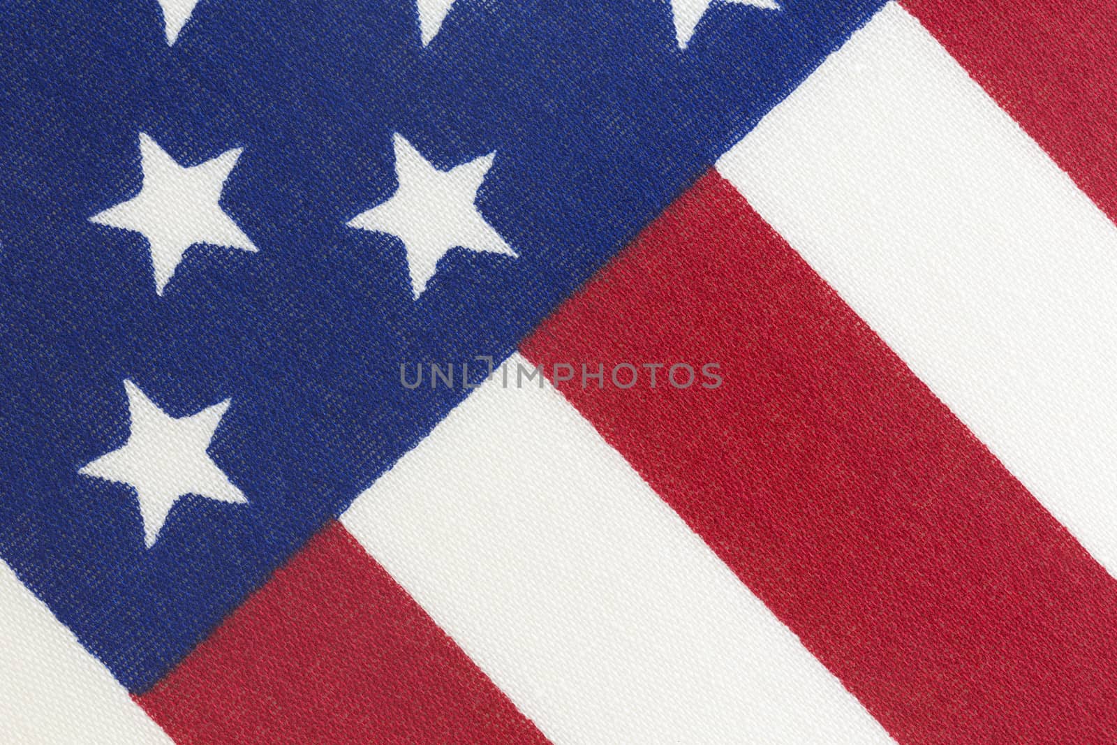 Background of American flag on diagonal and in close up photo.