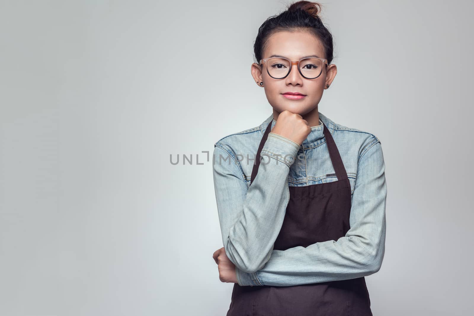 Asian woman standing with determination.