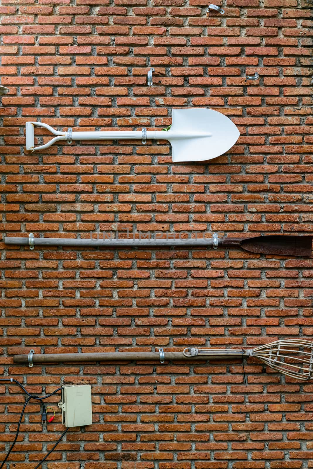 Equipment attached to a brick wall, Background by PhairinThee