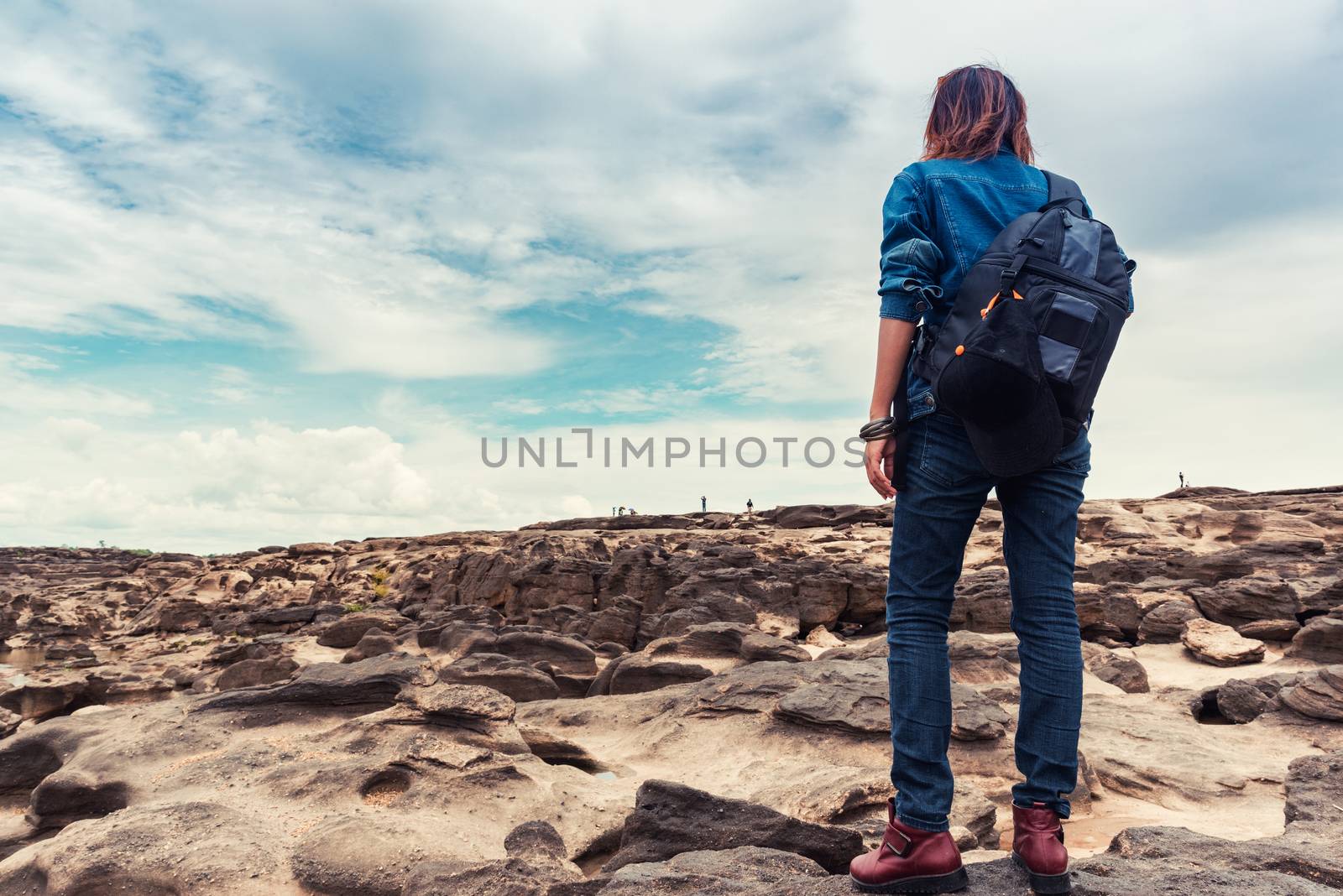 Asian woman enjoying the climbing natural stone,Focus on Women. by PhairinThee